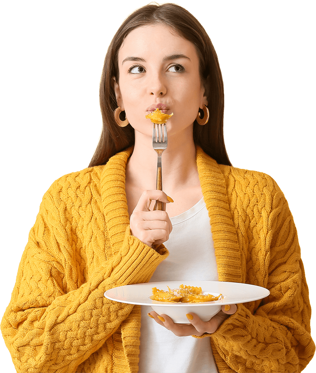 girl eating plate of ravioli