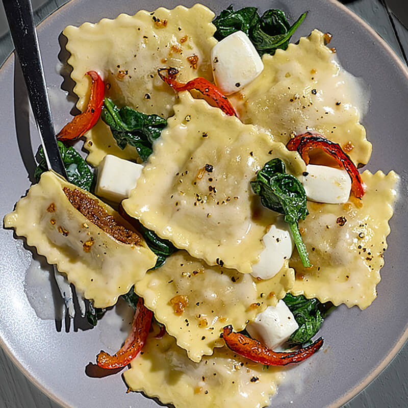 Ravioli with Mozzarella, Roasted Peppers & Spinach featuring Impossible™ Italian Sausage Made From Plants