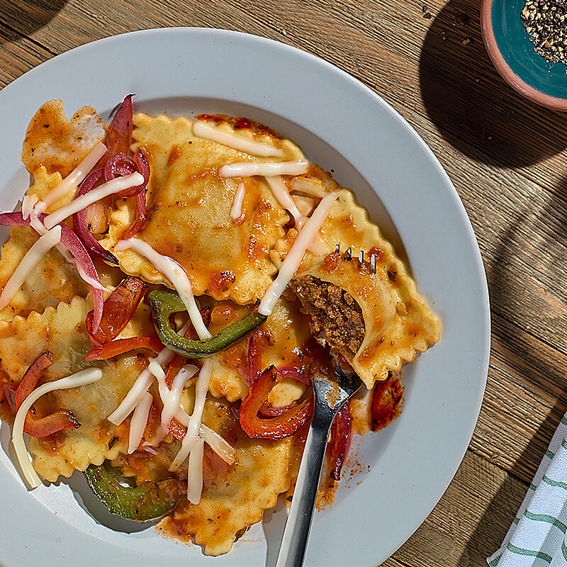 Ravioli Melt with Peppers & Onions featuring Impossible™ Italian Sausage Made From Plants