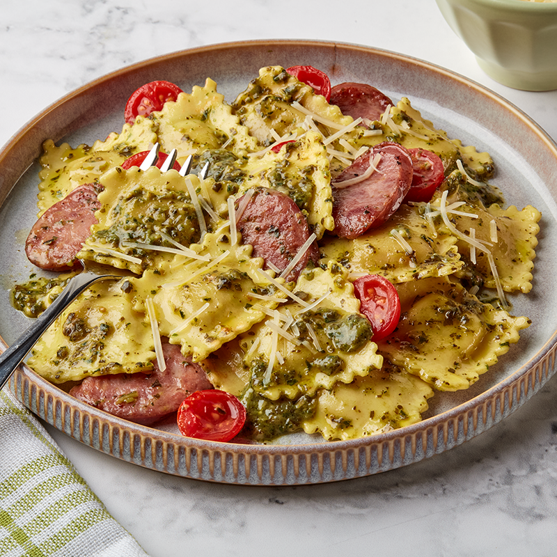 Pesto Ravioli with Sausage and Tomatoes